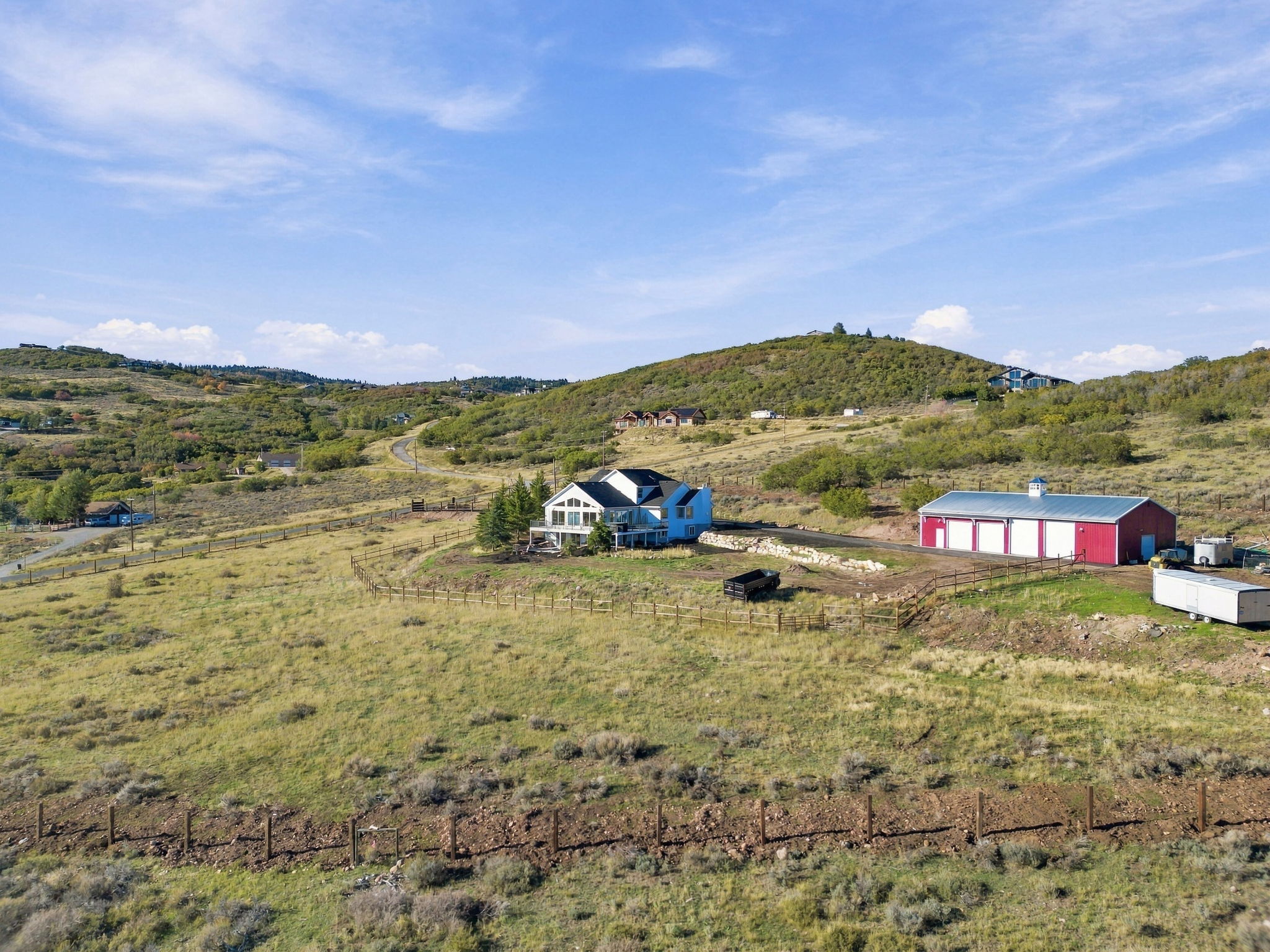 Long view over the home, barn, and Snyderville Basin