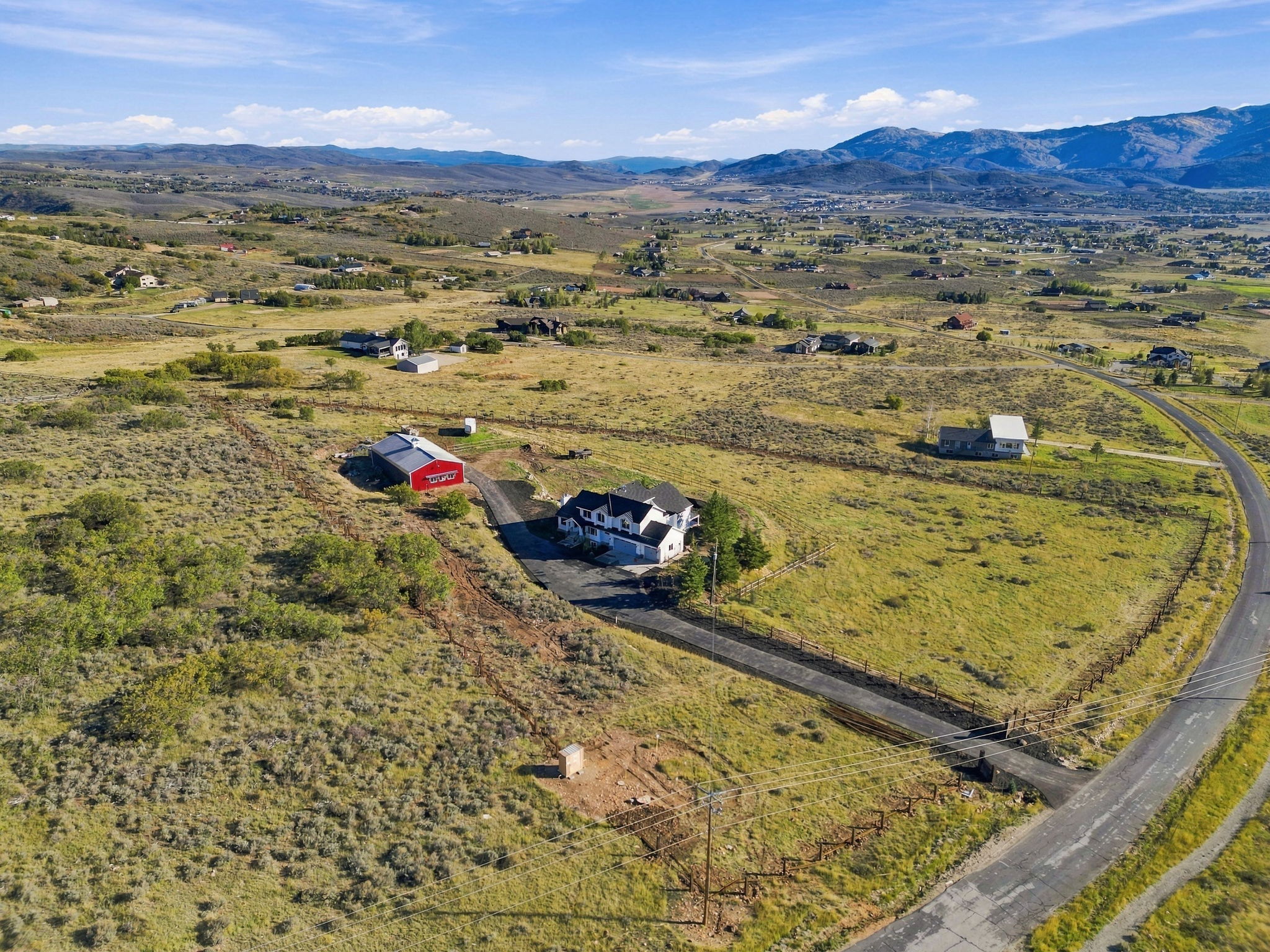 Wide aerial view from Silver Creek Reserve toward the Park City ski resorts